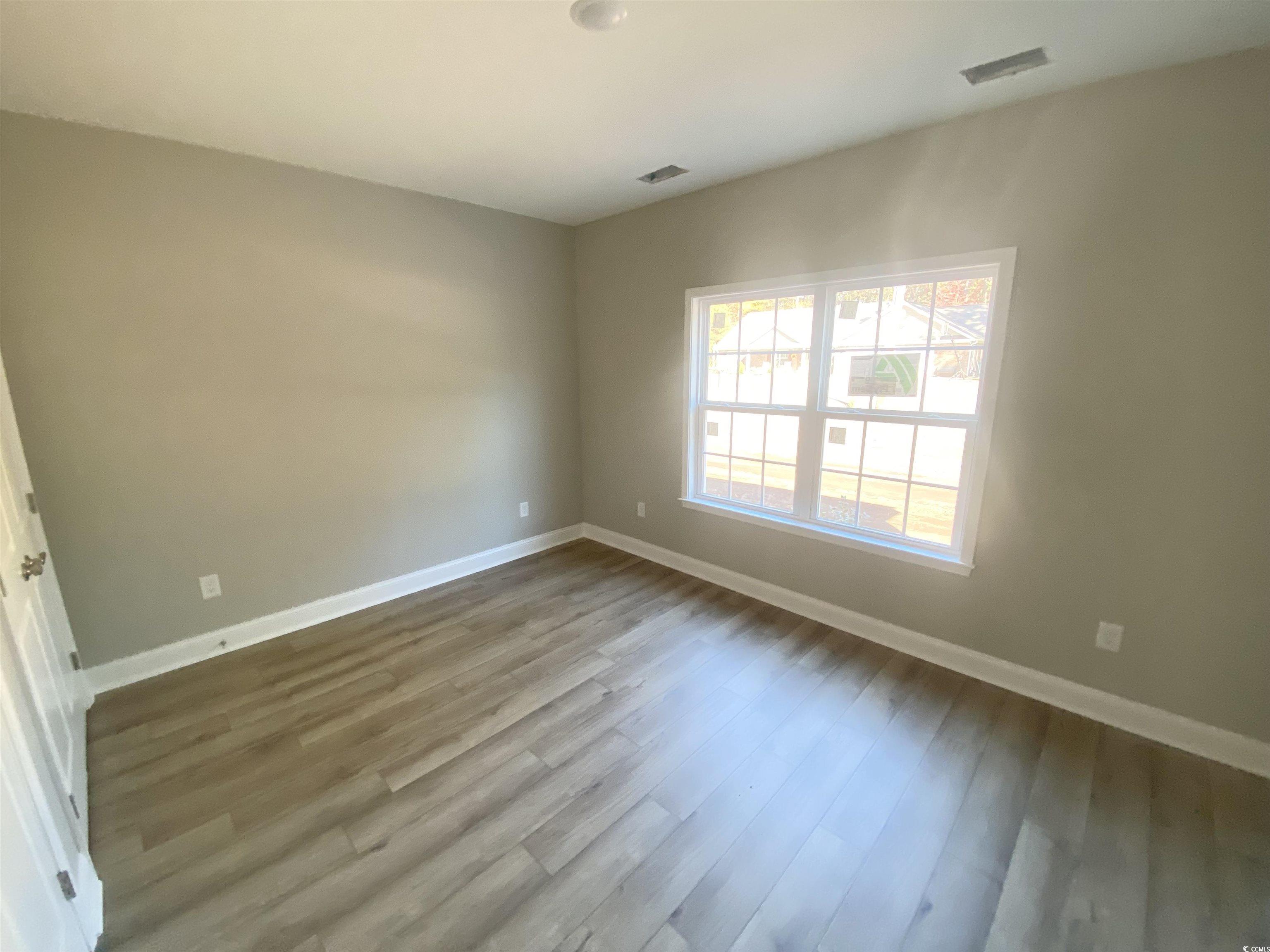 5553 Grape Arbor Lane Myrtle Beach, SC 29588 - Photo 27 of 35 Unfurnished room featuring light wood-style floors