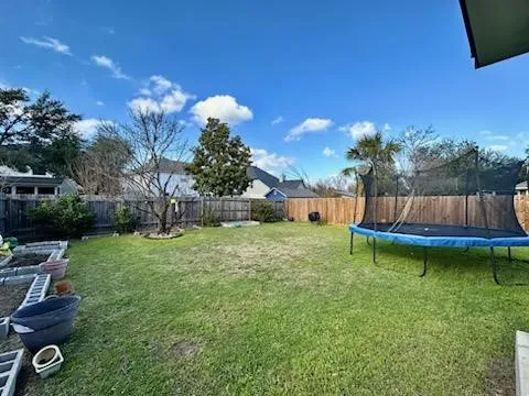 a view of a backyard with swimming pool
