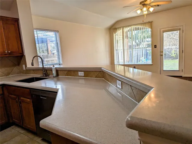 a kitchen with a sink and a window