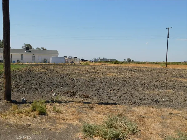 a view of a beach with a house