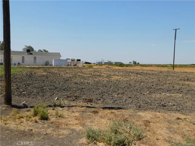 a view of a beach with a house