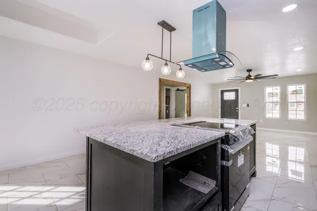 a kitchen with a counter space cabinets and appliances