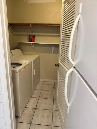 a utility room with washer and dryer