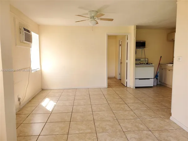 a view of an empty room with a bathroom