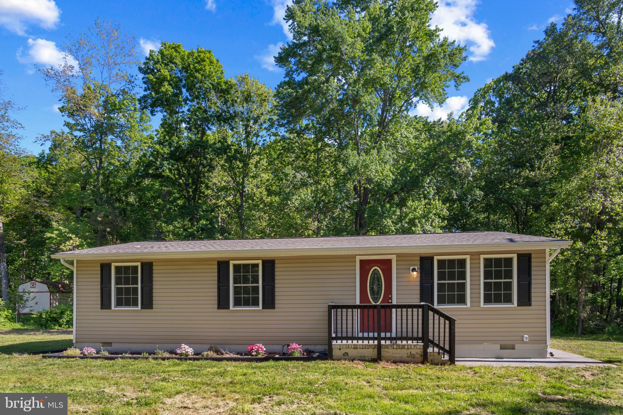 14408 Old Ridge Road Beaverdam, VA 23015 - Photo 1 of 26 a front view of a house with a garden