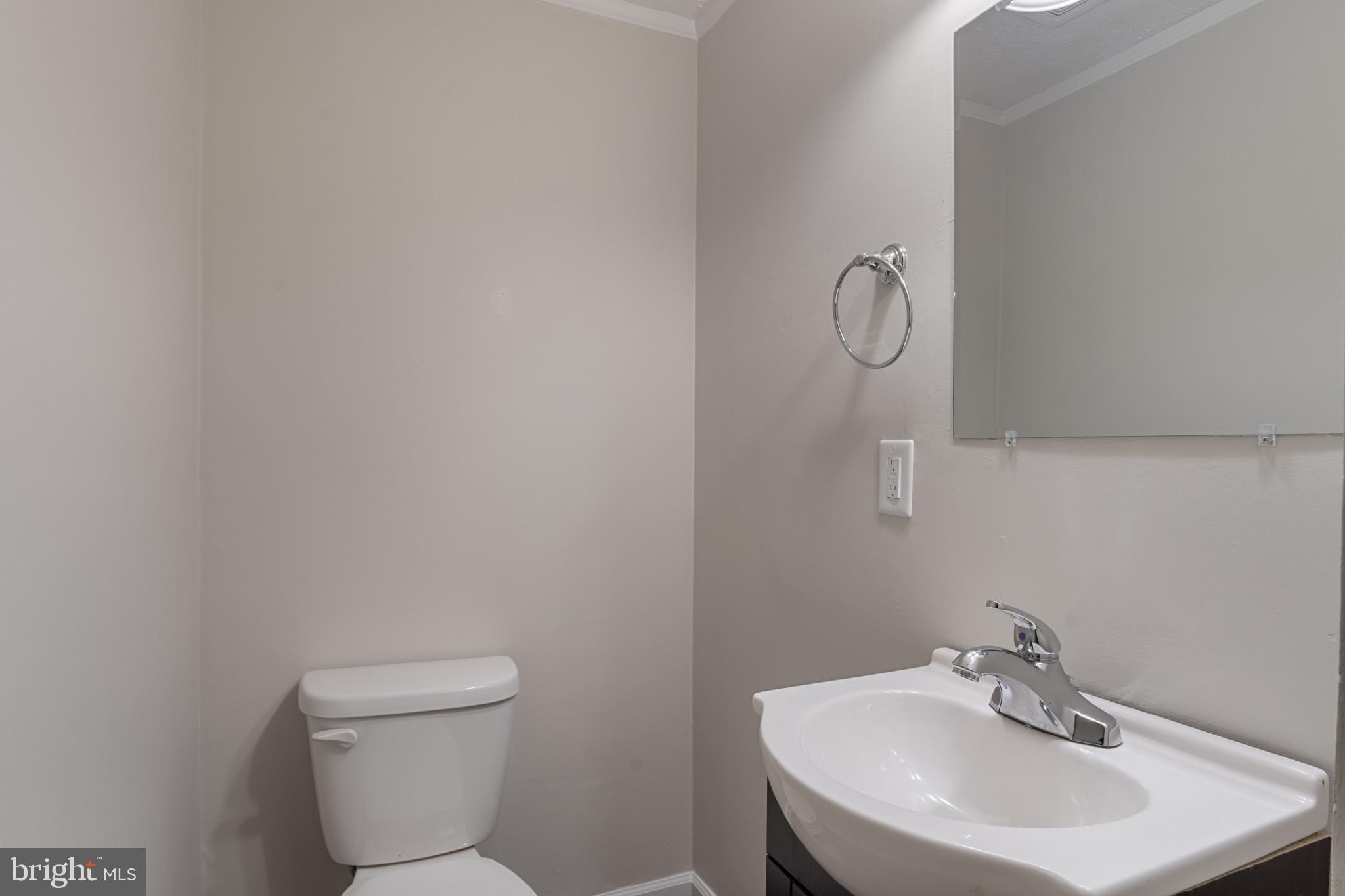 14408 Old Ridge Road Beaverdam, VA 23015 - Photo 21 of 26 a bathroom with a toilet sink and mirror