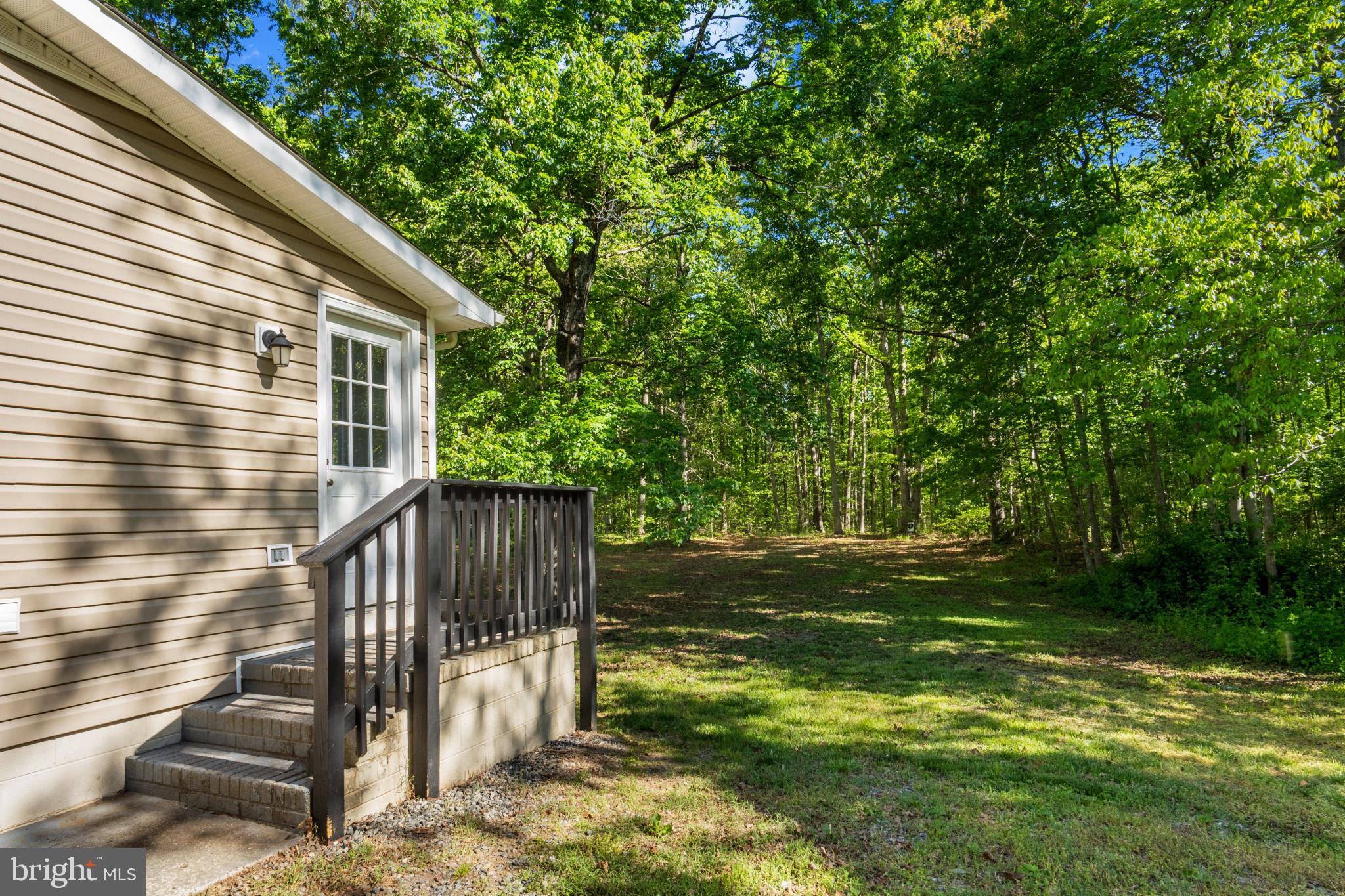 14408 Old Ridge Road Beaverdam, VA 23015 - Photo 22 of 26 a view of a backyard with stairs
