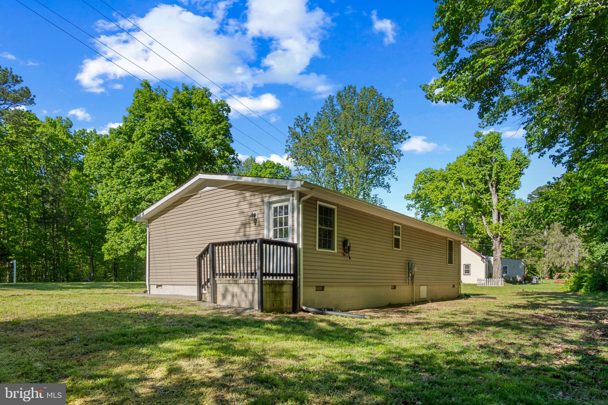 14408 Old Ridge Road Beaverdam, VA 23015 - Photo 24 of 26 a view of a house with a yard