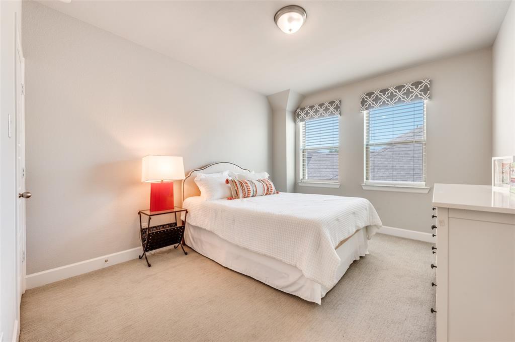 7153 Copperleaf Drive Dallas, TX 75231 - Photo 17 of 26 Carpeted bedroom featuring baseboards