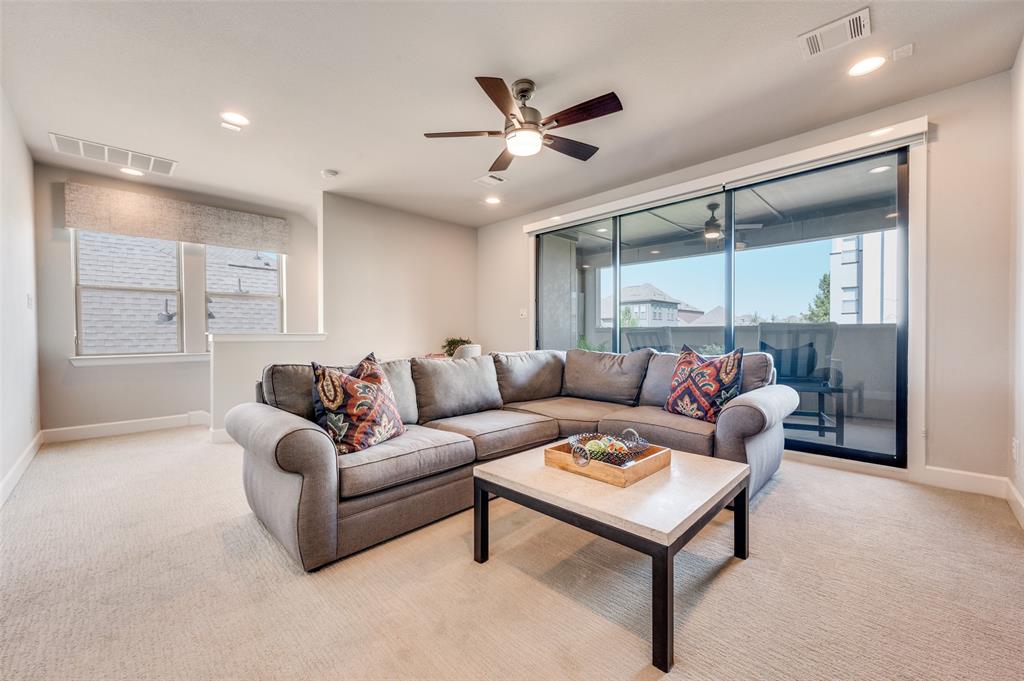 7153 Copperleaf Drive Dallas, TX 75231 - Photo 22 of 26 Living room with light colored carpet, healthy amount of natural light, a ceiling fan, and recessed lighting