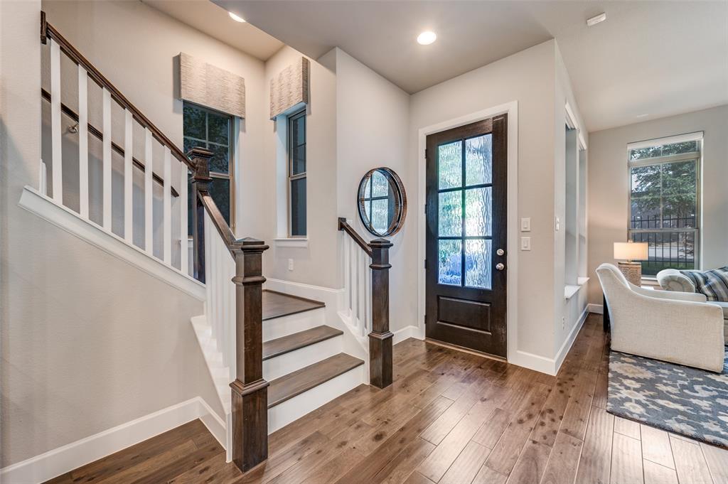 7153 Copperleaf Drive Dallas, TX 75231 - Photo 4 of 26 Entryway featuring hardwood / wood-style flooring, stairs, and recessed lighting