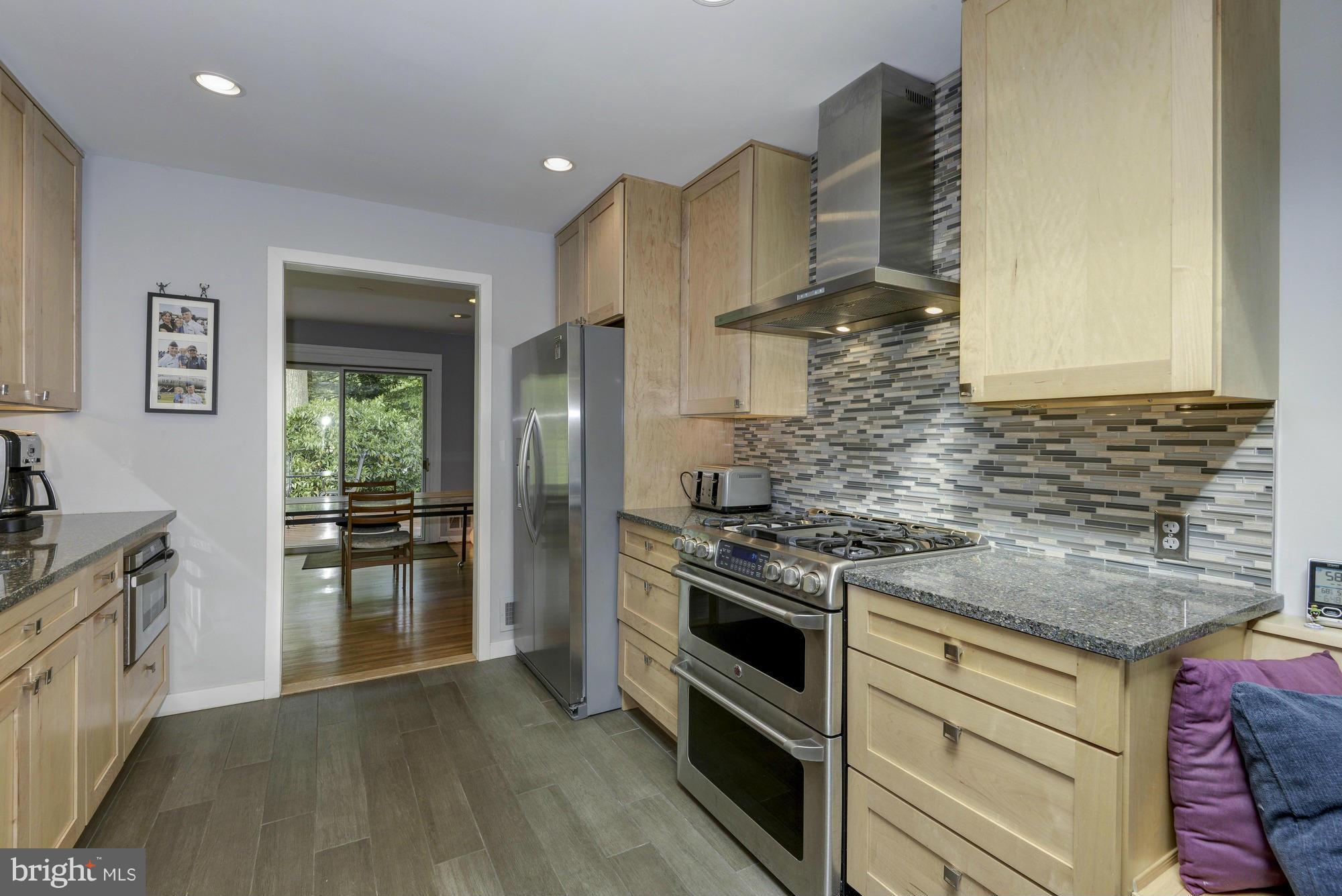 10823 Margate Road Silver Spring, MD 20901 - Photo 13 of 30 a kitchen with a stove and a sink