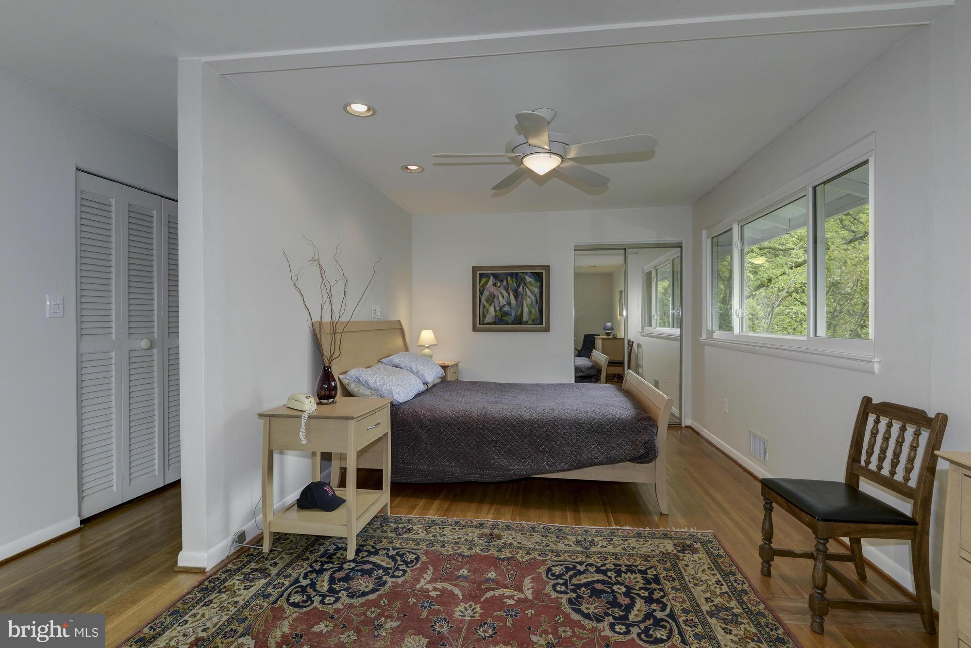 10823 Margate Road Silver Spring, MD 20901 - Photo 17 of 30 a bedroom with a bed and a chair