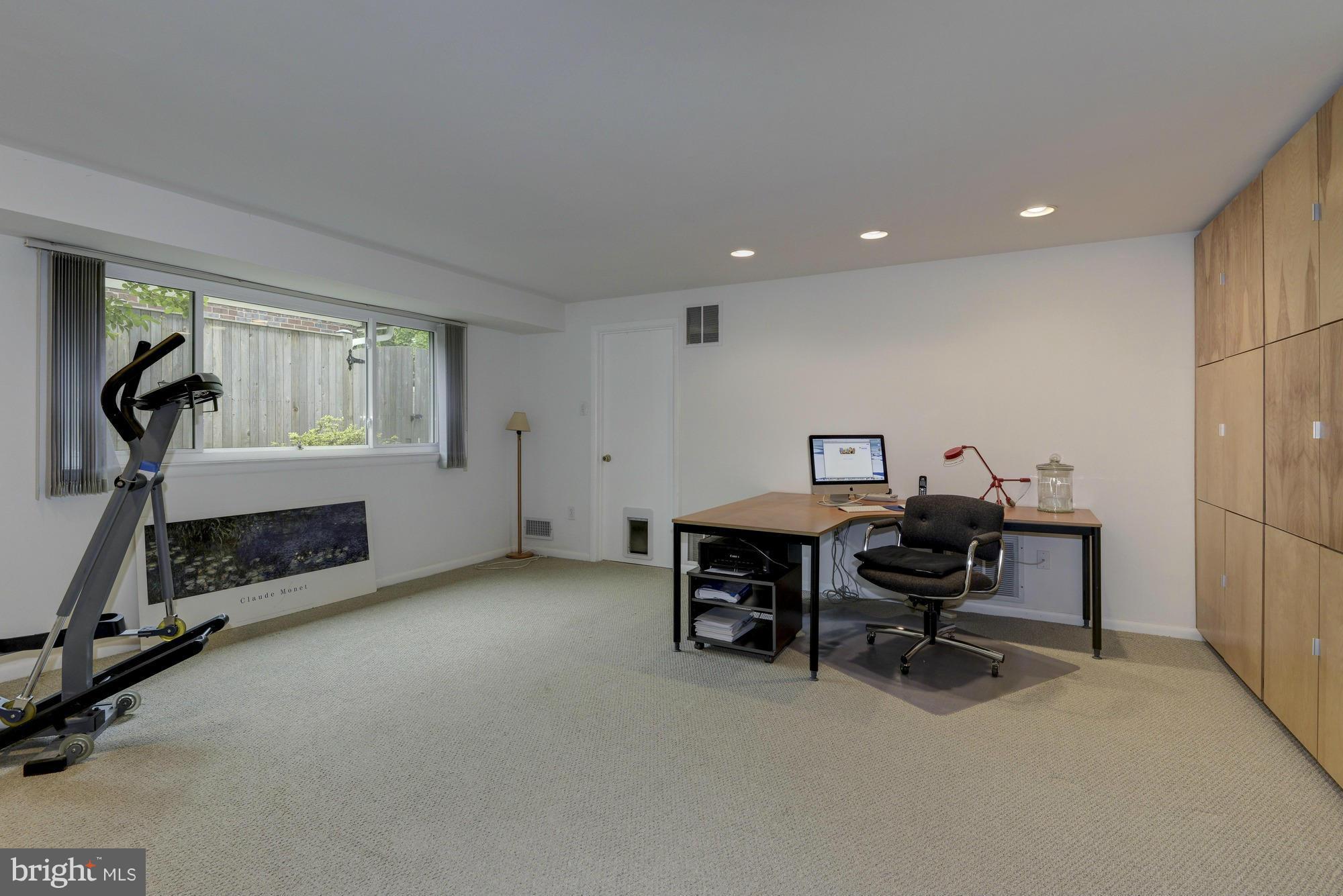 10823 Margate Road Silver Spring, MD 20901 - Photo 23 of 30 a view of a workspace with furniture and a window