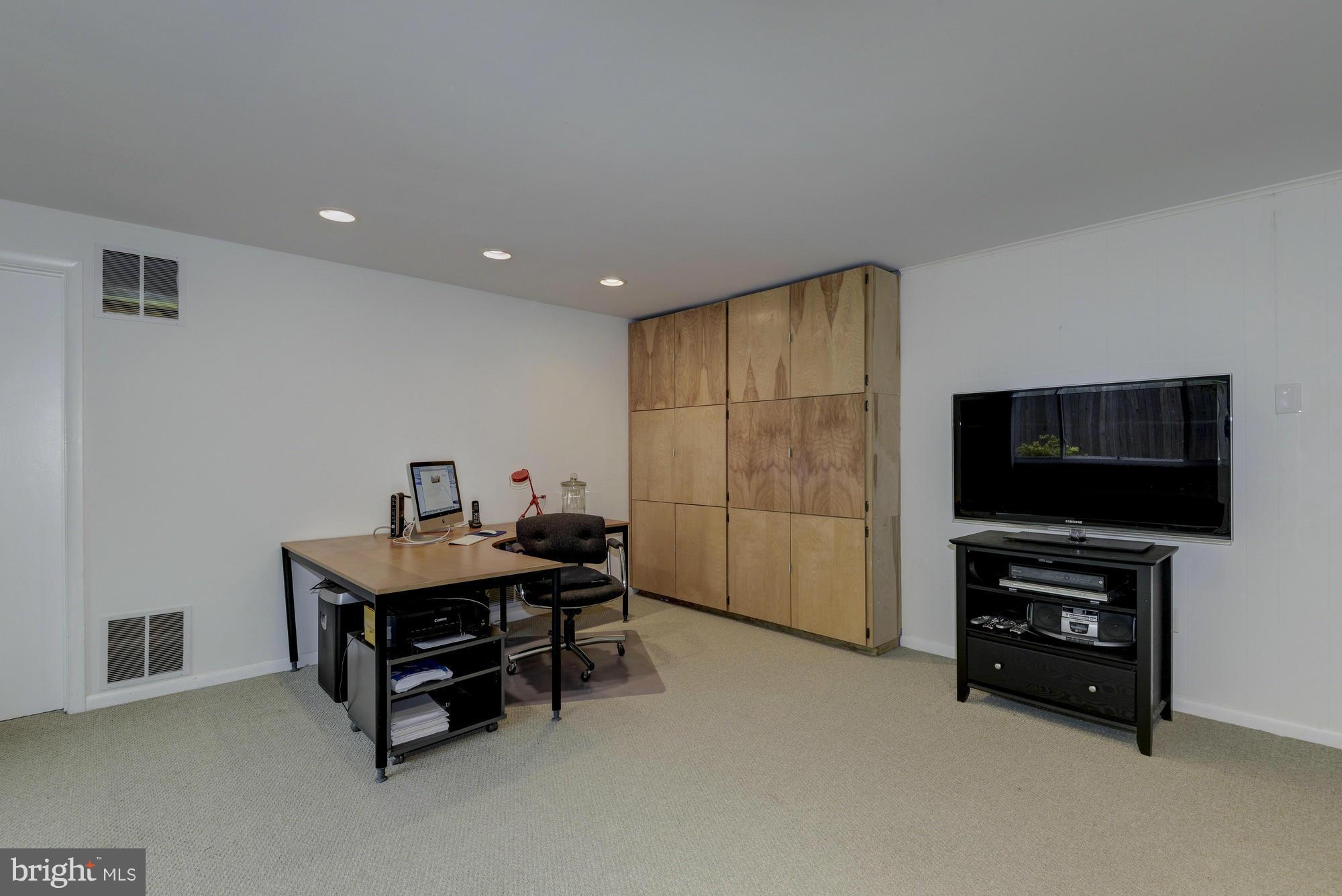 10823 Margate Road Silver Spring, MD 20901 - Photo 24 of 30 a living room with furniture and a flat screen tv