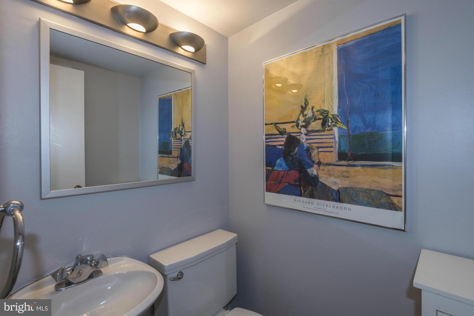 10823 Margate Road Silver Spring, MD 20901 - Photo 27 of 30 a bathroom with a toilet sink and mirror