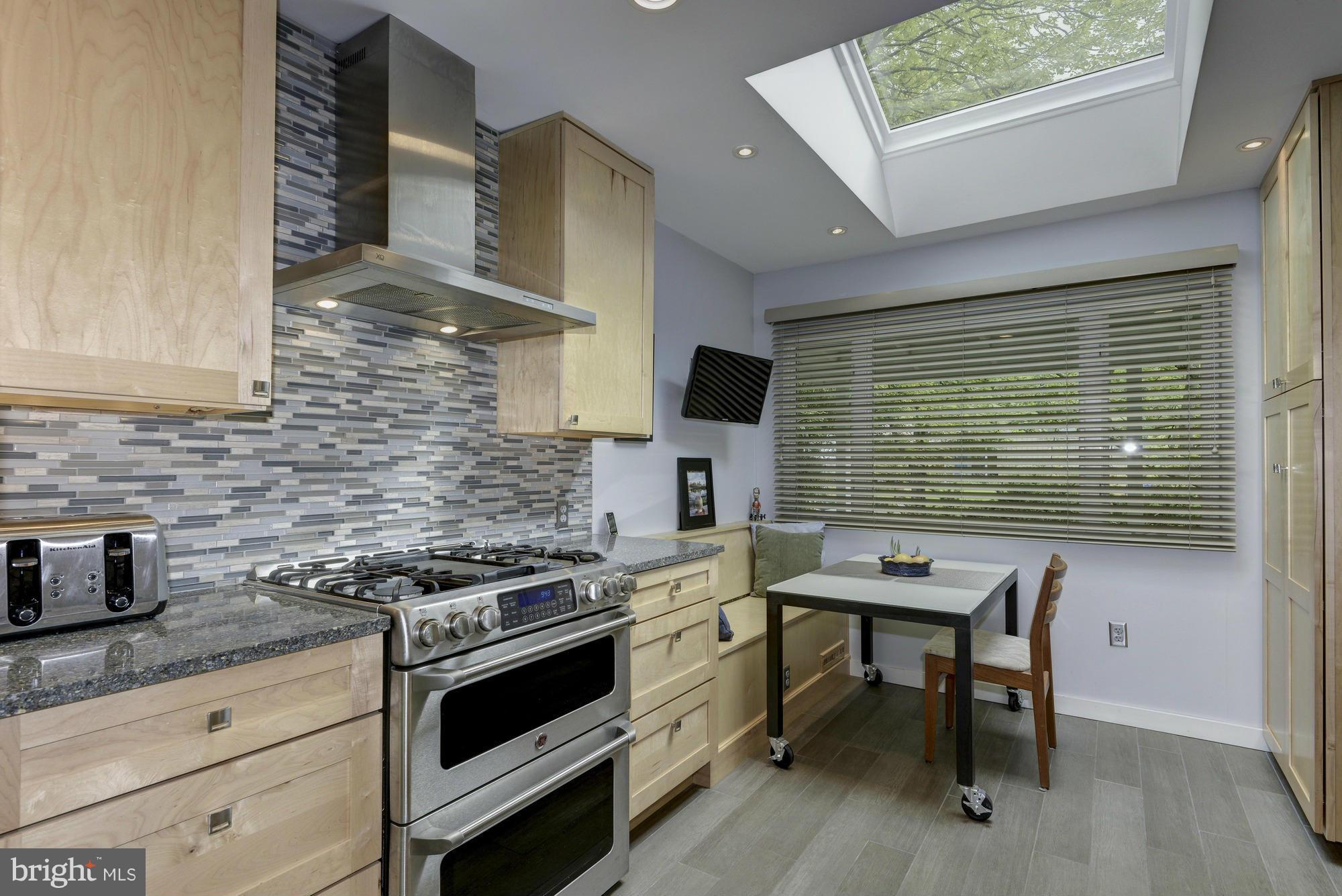 10823 Margate Road Silver Spring, MD 20901 - Photo 10 of 30 a kitchen that has a stove and a table
