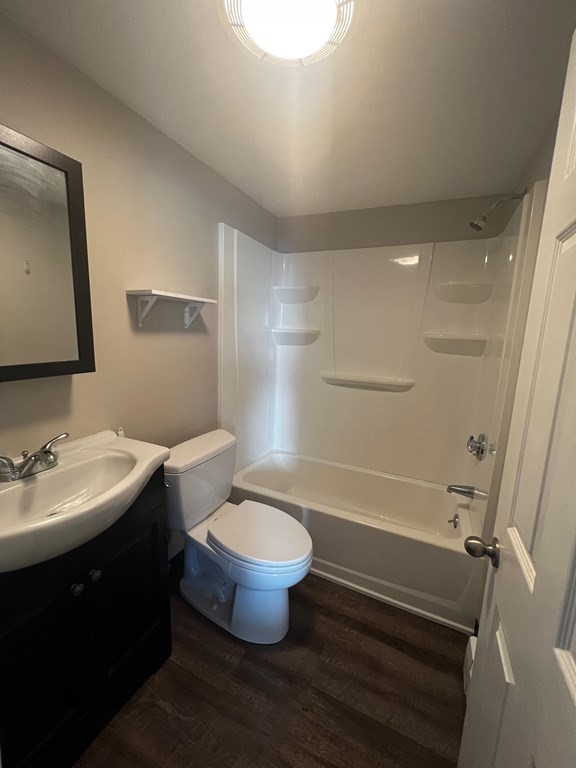 933 Ocean Boulevard, Unit 27 Hampton, NH 03842 - Photo 7 of 9 a bathroom with a sink toilet and shower