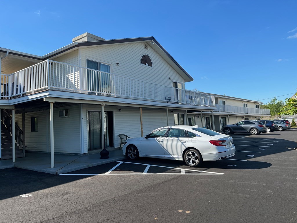 933 Ocean Boulevard, Unit 27 Hampton, NH 03842 - Photo 9 of 9 a car parked in front of a building