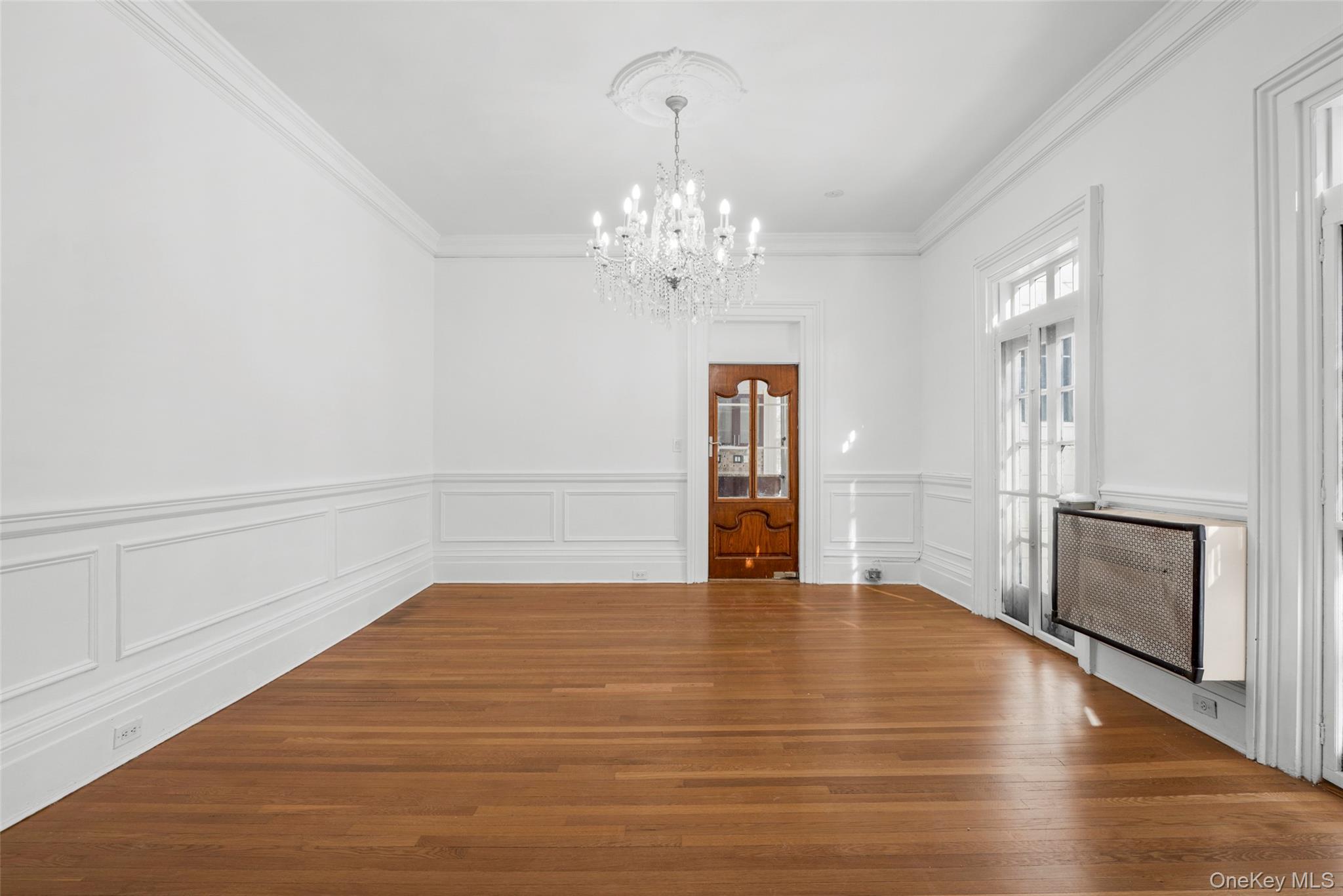 1146 North Avenue New Rochelle, NY 10804 - Photo 17 of 50 a view of an empty room with a kitchen