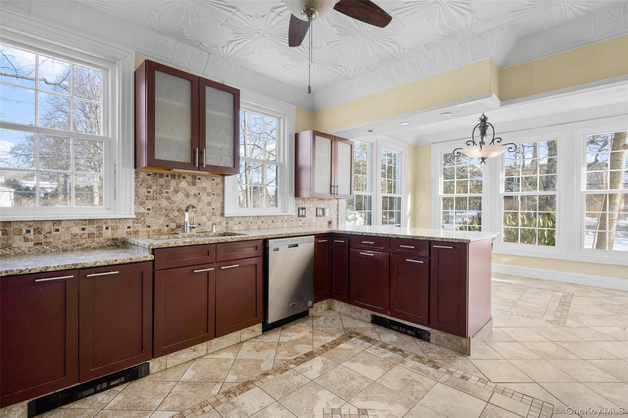 1146 North Avenue New Rochelle, NY 10804 - Photo 21 of 50 a large kitchen with kitchen island granite countertop a large window and a sink