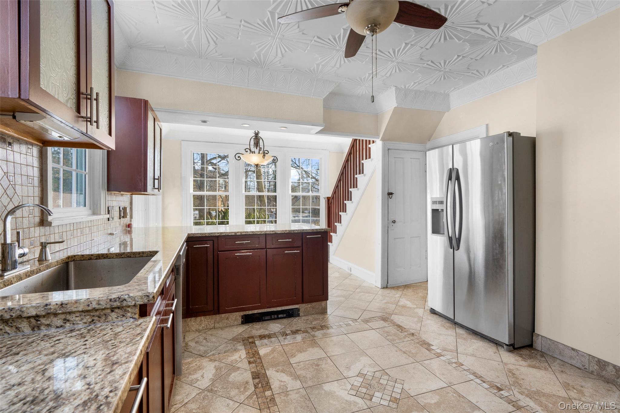 1146 North Avenue New Rochelle, NY 10804 - Photo 25 of 50 a kitchen with stainless steel appliances granite countertop a refrigerator and a sink