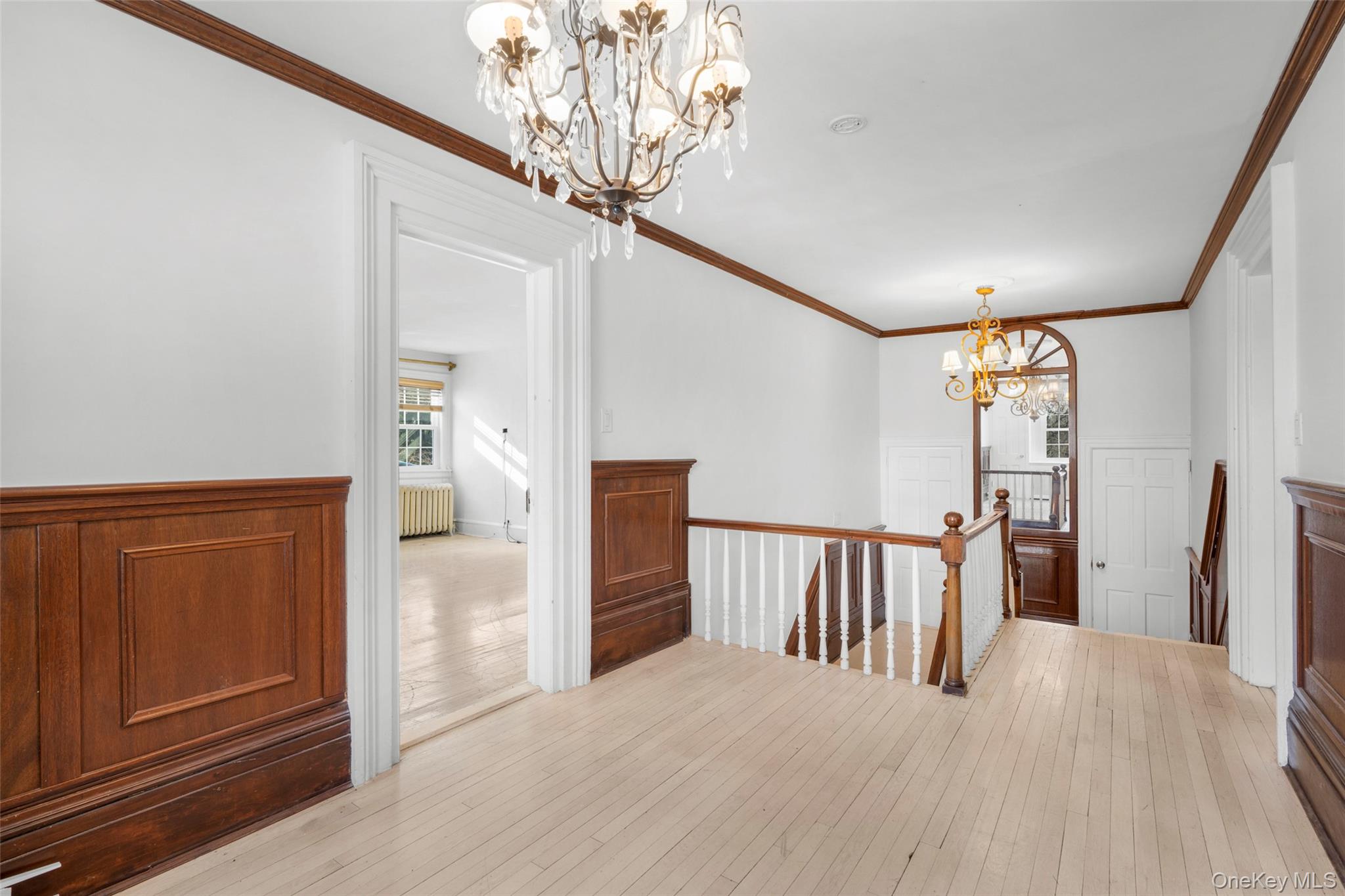 1146 North Avenue New Rochelle, NY 10804 - Photo 38 of 50 a view of a hallway with windows and chandelier
