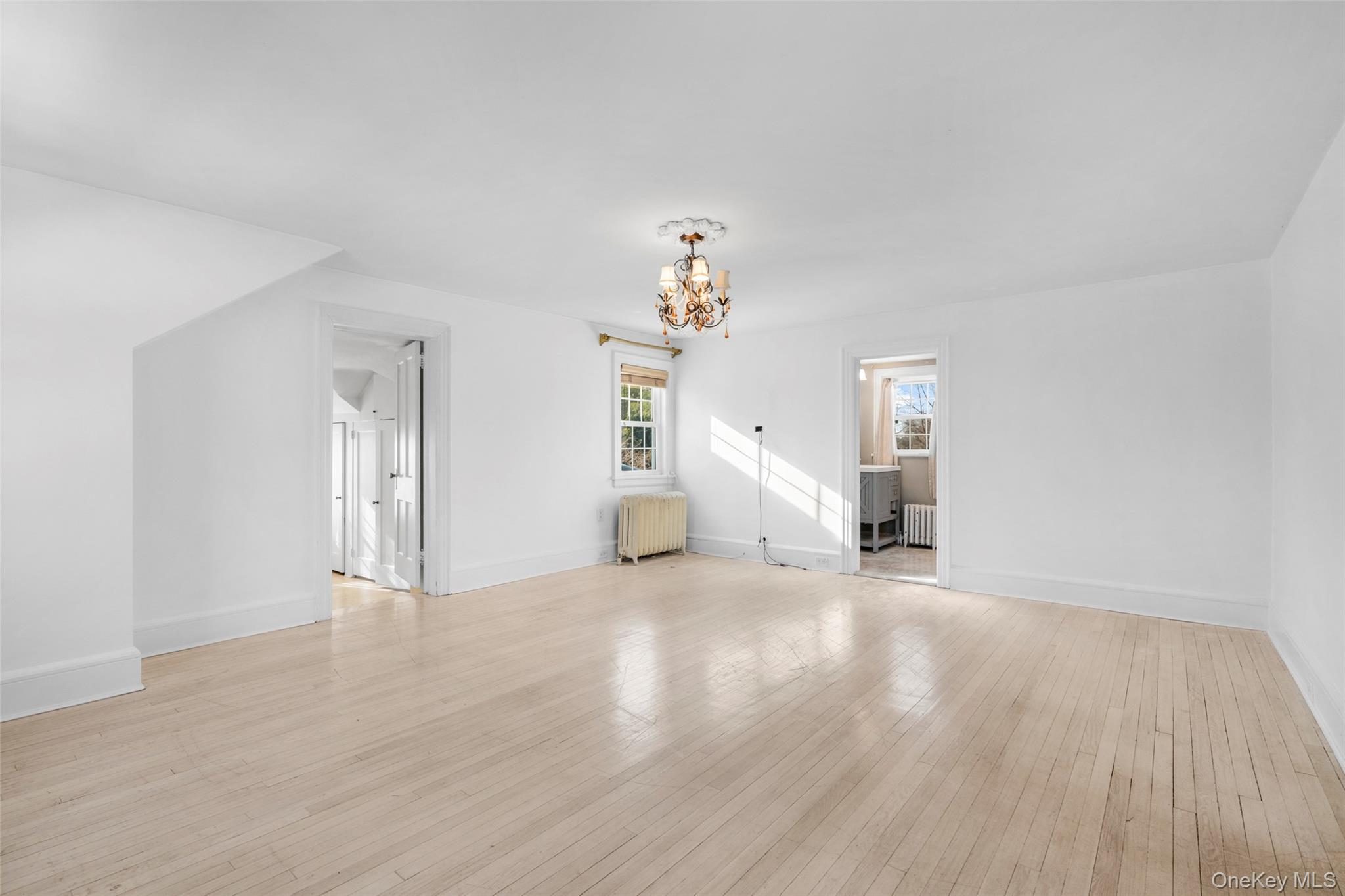 1146 North Avenue New Rochelle, NY 10804 - Photo 40 of 50 a view of a livingroom with wooden floor and a large window