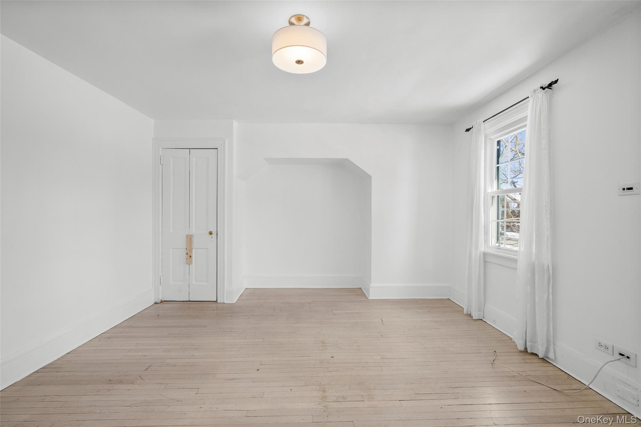 1146 North Avenue New Rochelle, NY 10804 - Photo 46 of 50 wooden floor in an empty room