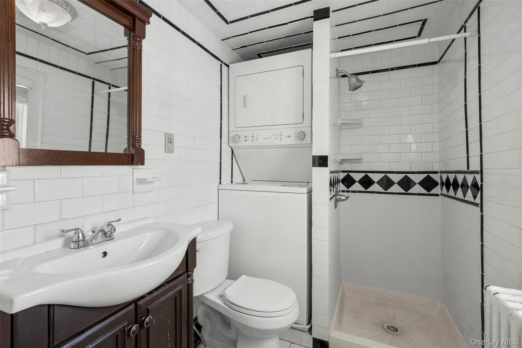 1146 North Avenue New Rochelle, NY 10804 - Photo 48 of 50 a bathroom with a sink toilet and shower