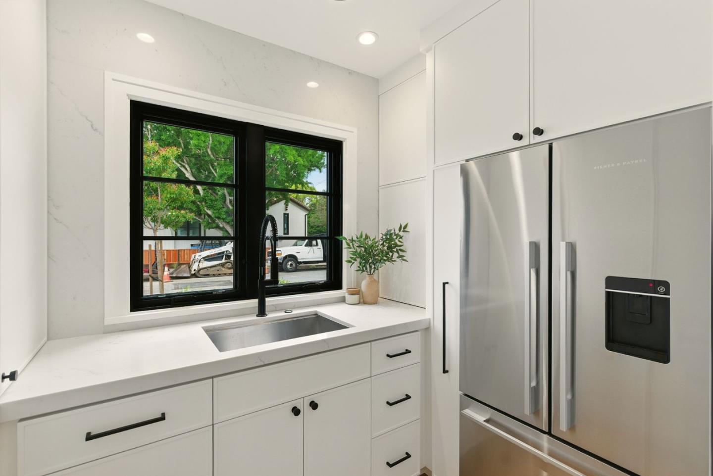 240 Bancroft Road Burlingame, CA 94010 - Photo 12 of 41 a kitchen with stainless steel appliances a sink a refrigerator a window and a refrigerator