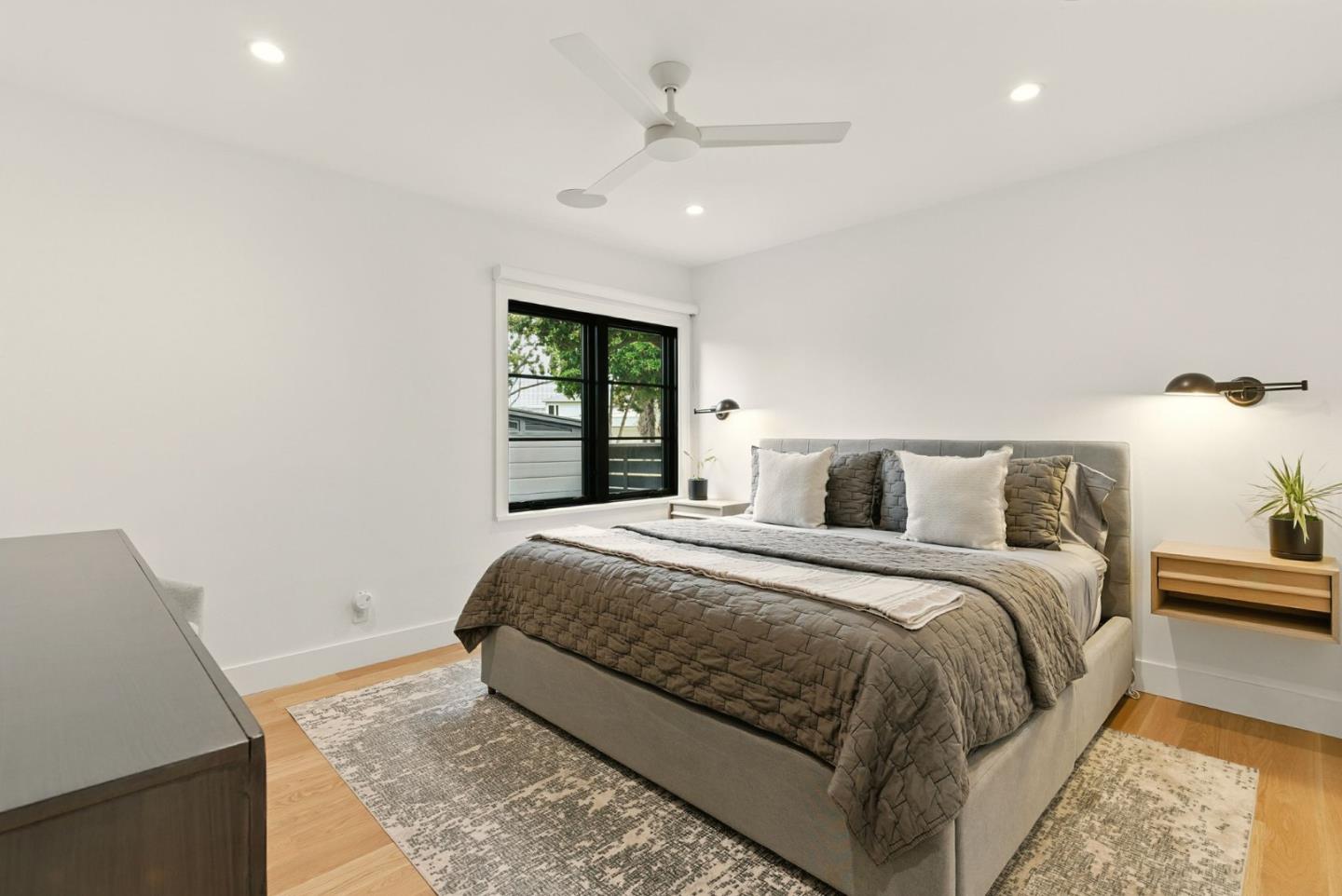 240 Bancroft Road Burlingame, CA 94010 - Photo 14 of 41 a bed room with a bed and a night stand