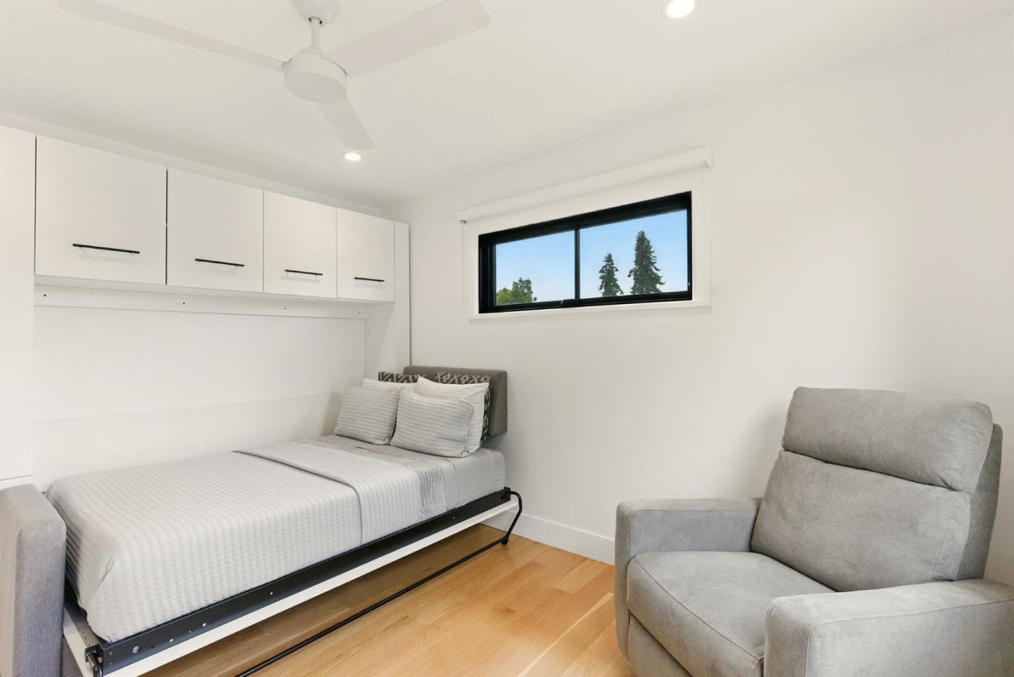 240 Bancroft Road Burlingame, CA 94010 - Photo 21 of 41 a bedroom with a bed couch and view living room