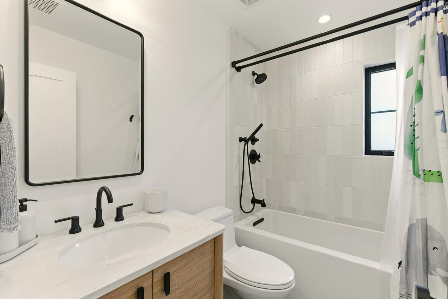 240 Bancroft Road Burlingame, CA 94010 - Photo 22 of 41 a bathroom with a granite countertop sink mirror toilet and bathtub