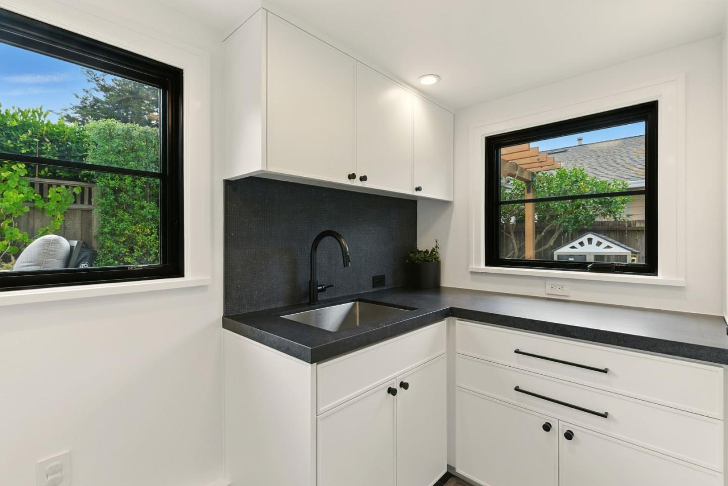240 Bancroft Road Burlingame, CA 94010 - Photo 25 of 41 a kitchen with granite countertop a stove and a sink