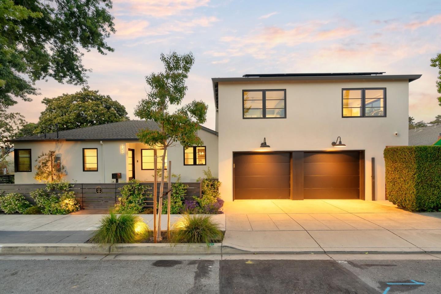 240 Bancroft Road Burlingame, CA 94010 - Photo 31 of 41 a front view of a house with a yard and garage