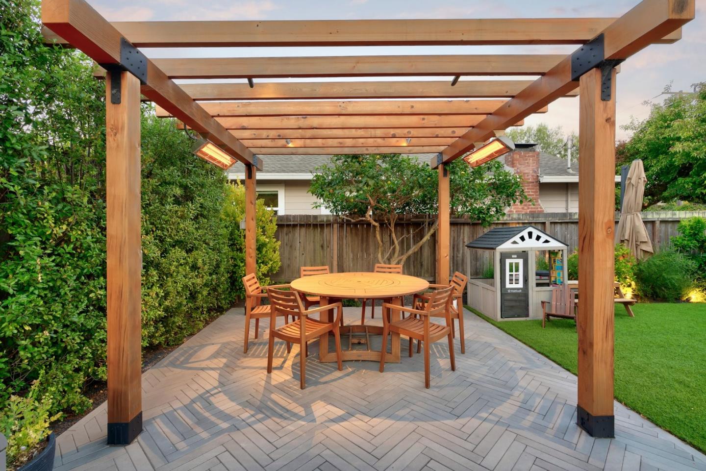 240 Bancroft Road Burlingame, CA 94010 - Photo 39 of 41 a view of a patio with a table chairs and a backyard