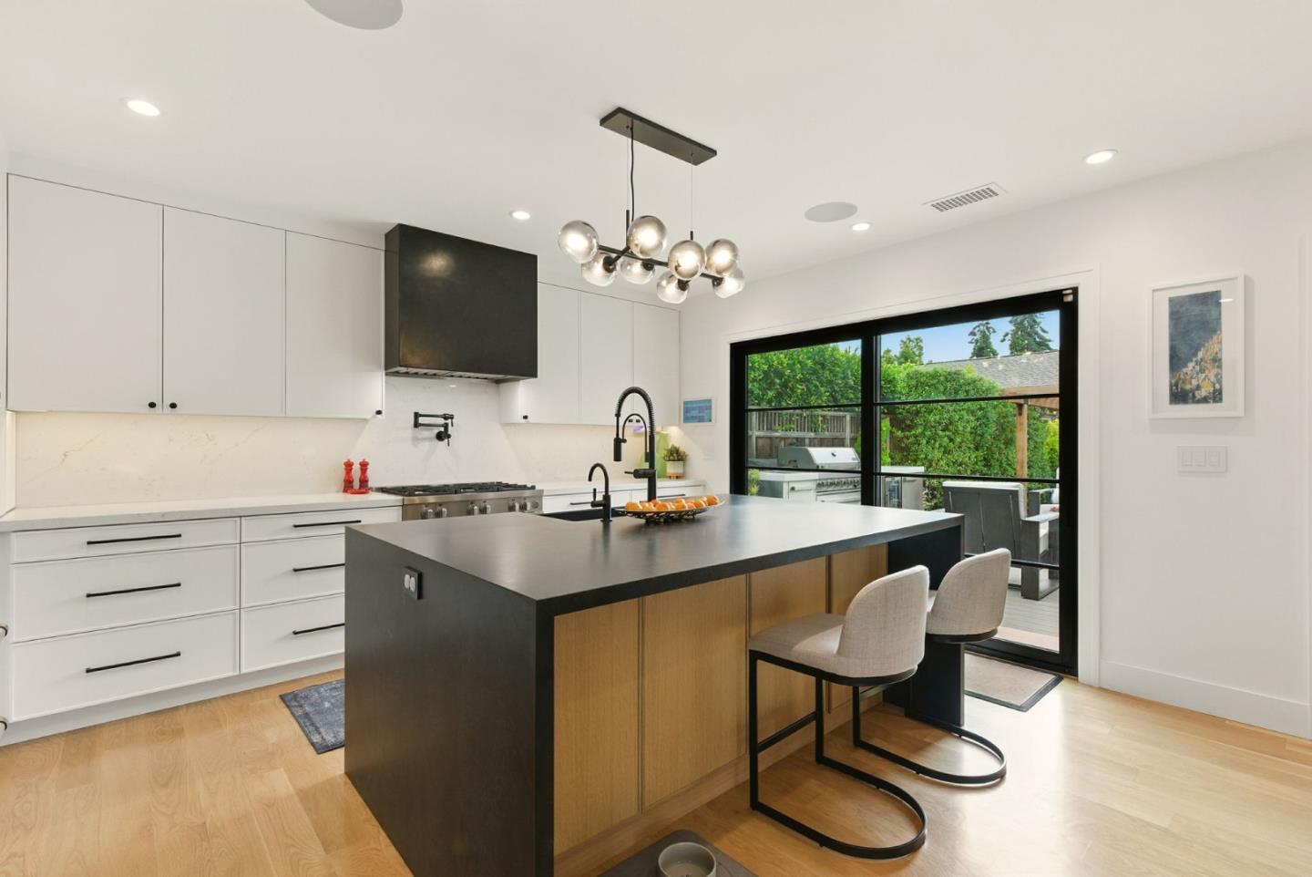 240 Bancroft Road Burlingame, CA 94010 - Photo 10 of 41 a kitchen with a sink and chairs
