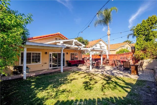 a view of a chairs and table in backyard