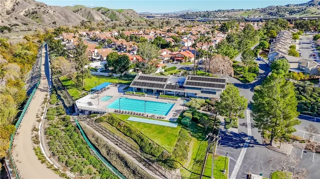an aerial view of a swimming pool patio and mountain view