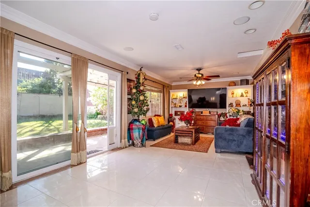a living room with lots of furniture and a flat screen tv