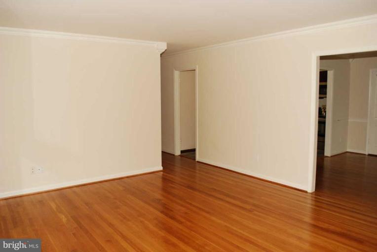 1904 Old Stage Road Alexandria, VA 22308 - Photo 2 of 21 a view of an empty room with wooden floor and closet