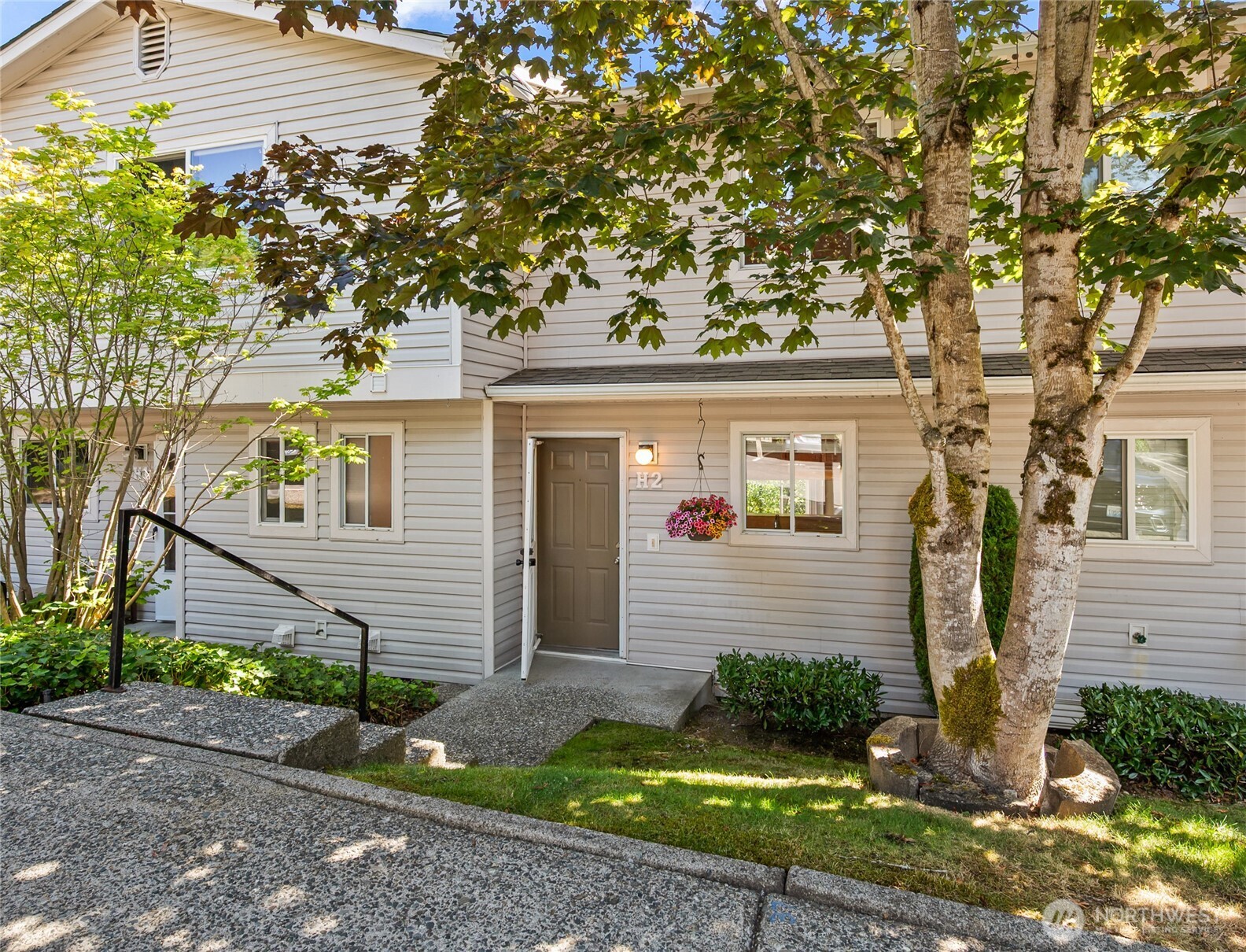 a front view of a house with garden