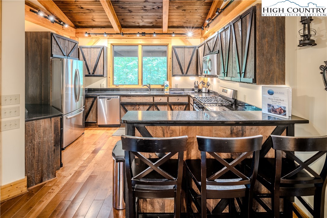 161 Hump View Trail Banner Elk, NC 28604 - Photo 11 of 50 a view of a chairs and table in the patio