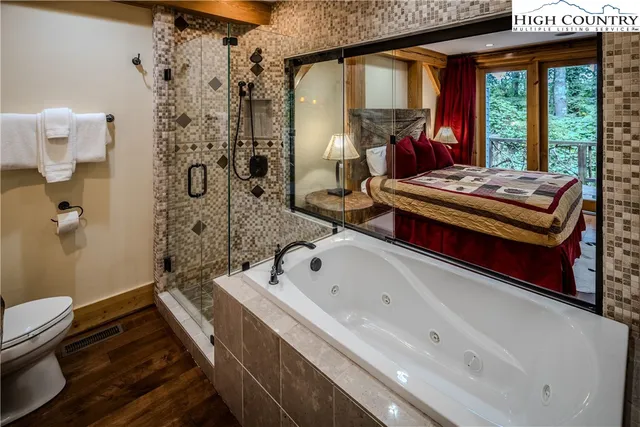 a bathroom with a bathtub and a shower
