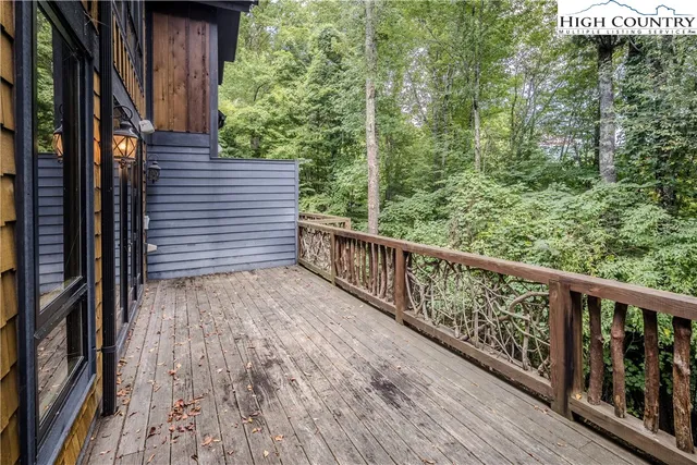 a view of a balcony with trees