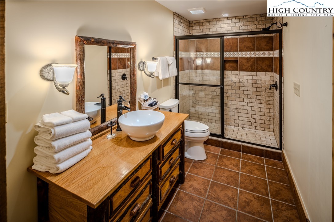 161 Hump View Trail Banner Elk, NC 28604 - Photo 26 of 50 a bathroom with a sink toilet and shower