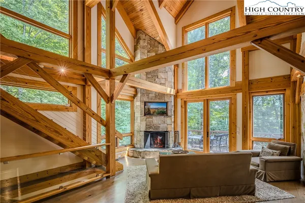 a living room with furniture a large window