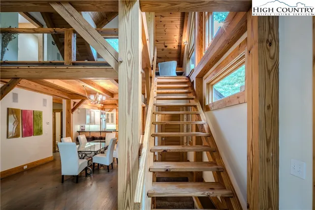 a view of an entryway with wooden floor and door
