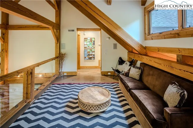 a living room with furniture and a rug